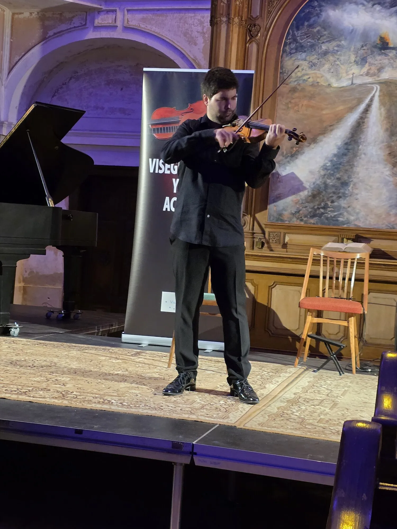 Milan Al-Ashhab teaching a violin lesson