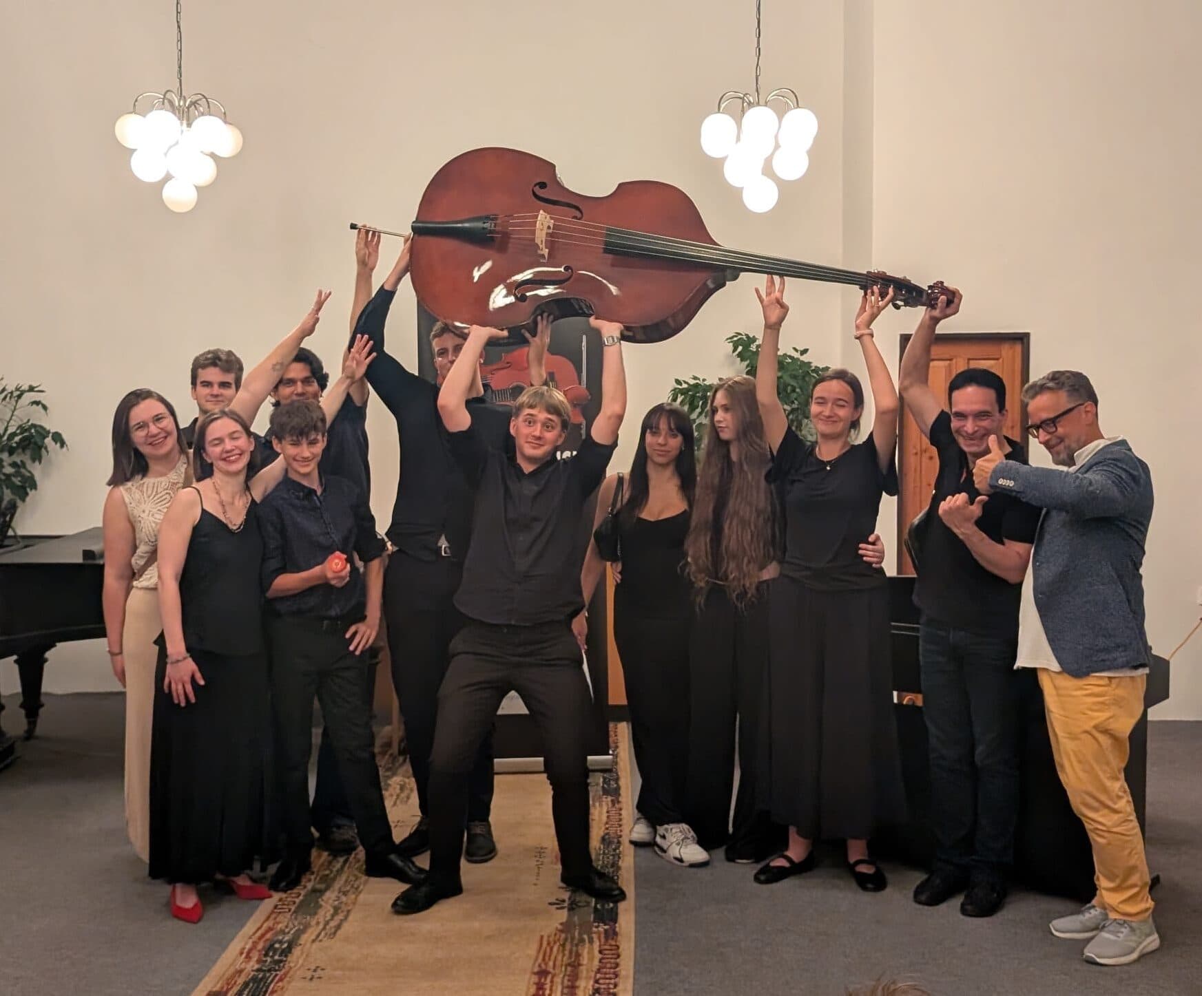 Double bass players after the concert